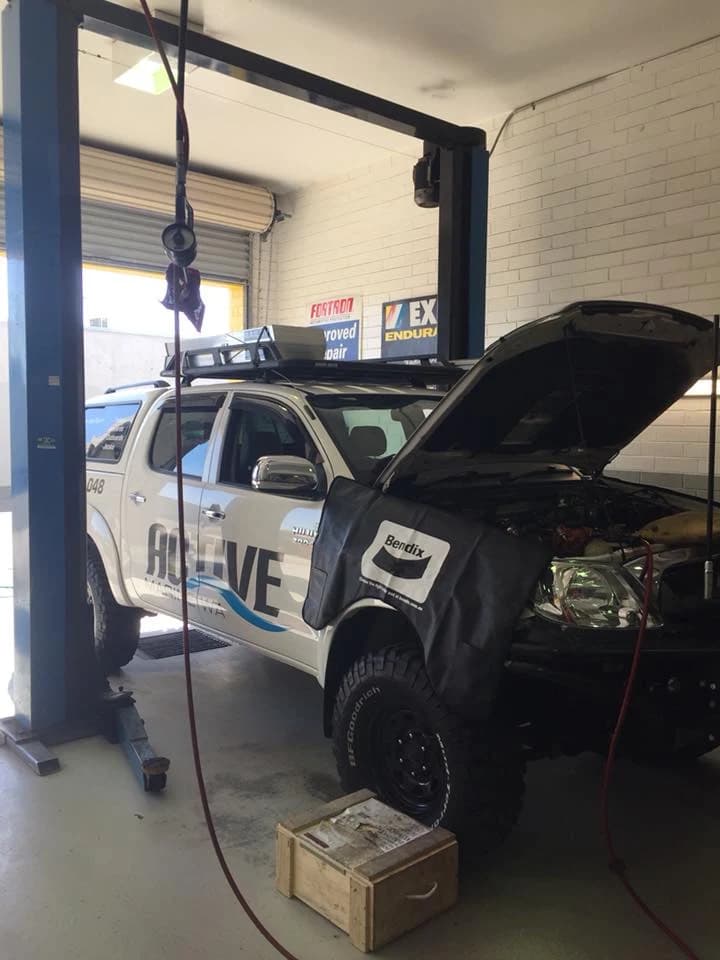 Vehicle raised on a hoist in the UTB Auto workshop