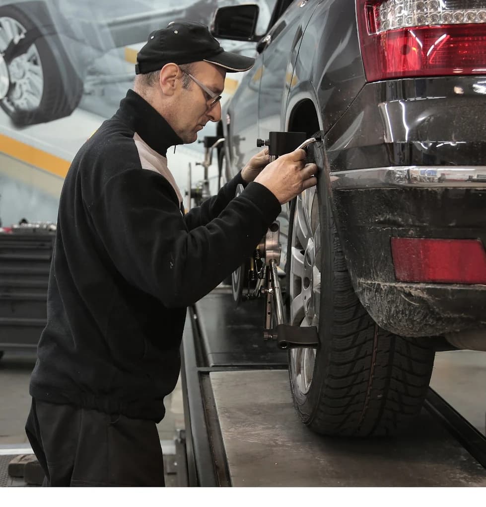 A UTB Auto mechanic carrying out a wheel alignment check